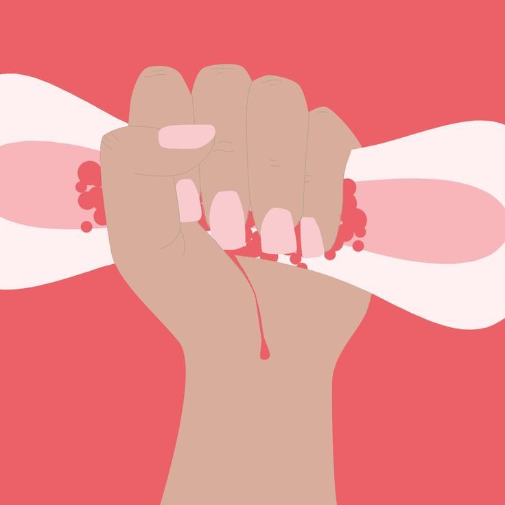 This may contain: a woman's hand with pink nail polish on her nails holding something in the air